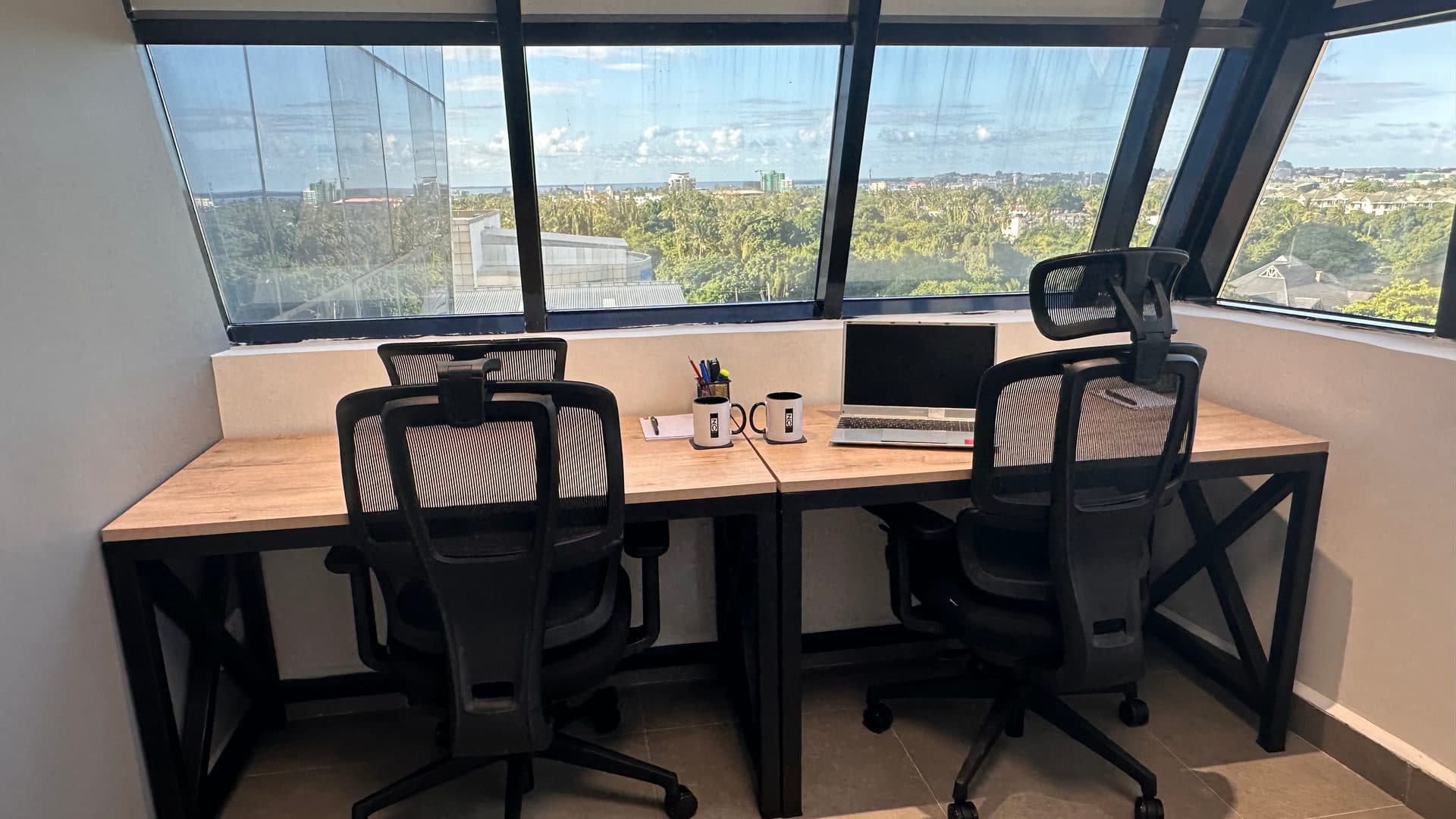 A two-person office on Level 7 with a view over the city