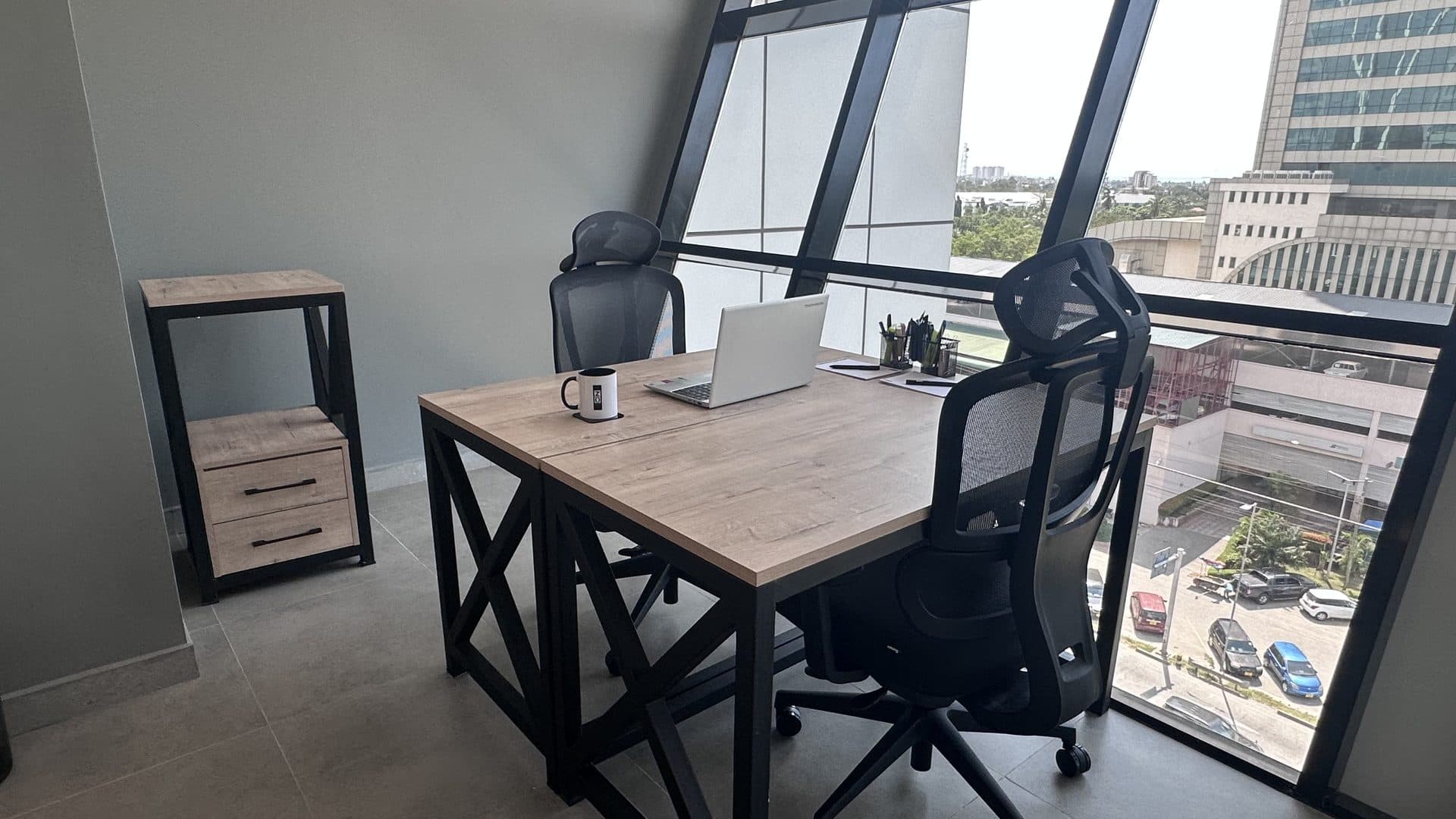 A single-person office on Level 7 with floor-to-ceiling windows