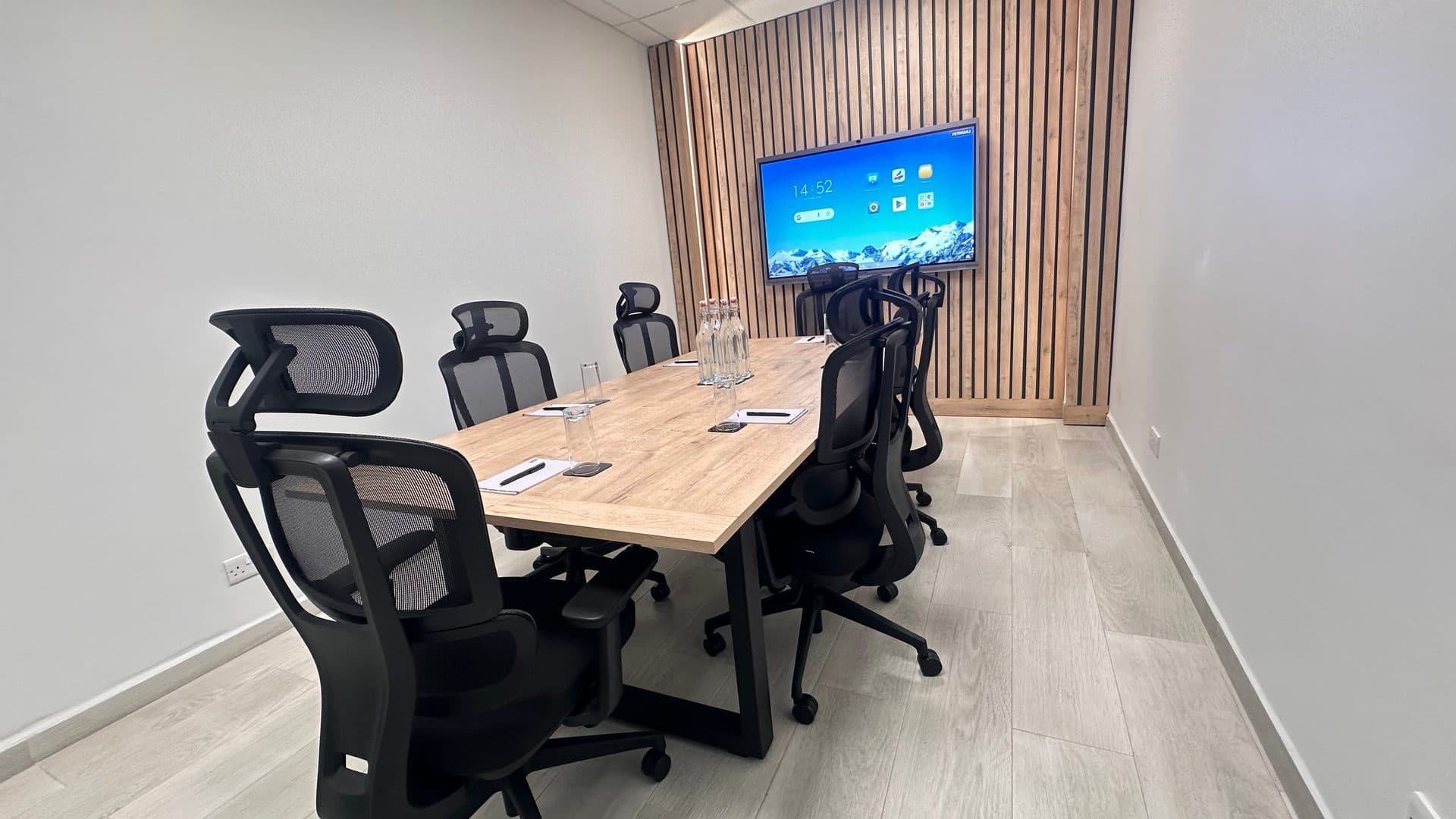 A meeting room at ZO Seacliff with an interactive screen